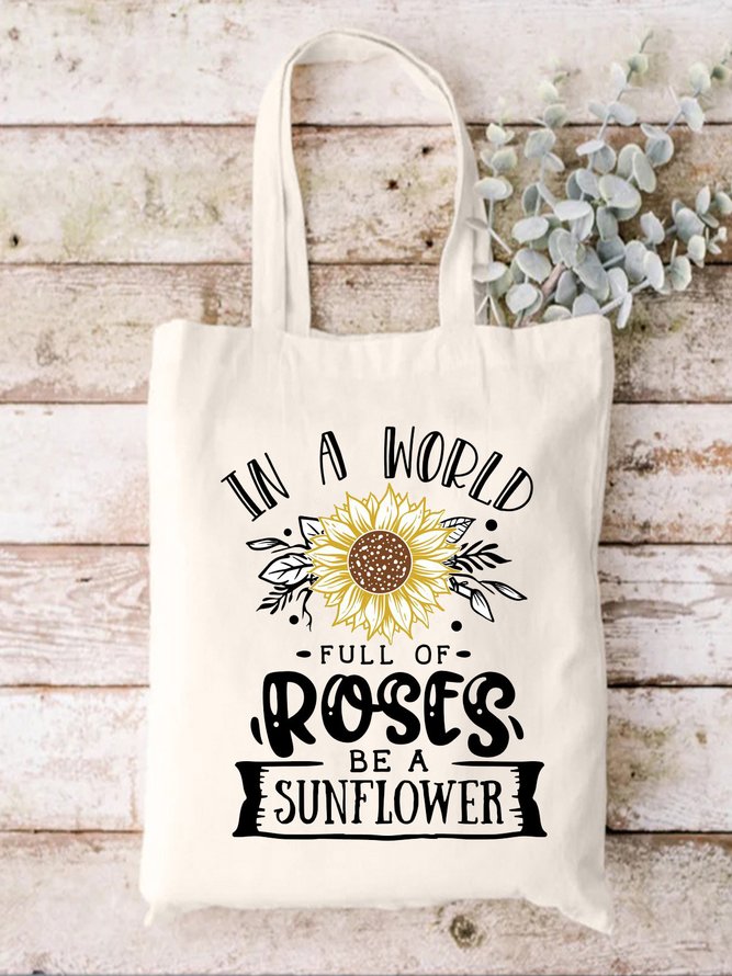 In A World Full Of Roses Be A Sunflower Plant Graphic Shopping Tote